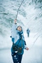 Woman playing in winter snow Royalty Free Stock Photo