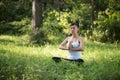 Woman playing yoga garden field weekend holiday lifestyle park outdoor nature Royalty Free Stock Photo