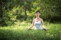 Woman playing yoga garden field weekend holiday lifestyle park outdoor nature Royalty Free Stock Photo