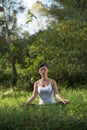 Woman playing yoga garden field weekend holiday lifestyle park outdoor nature Royalty Free Stock Photo