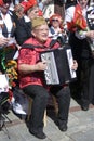 A woman plays accordeon.