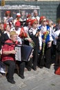 A woman plays accordeon.