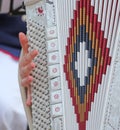 Woman plays the ancient accordion keyboard Royalty Free Stock Photo