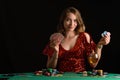 A woman plays in a casino. Woman puts a lot of chips. Gaming business and entertainment