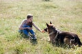 Woman plays with the dog German Shepherd when training Royalty Free Stock Photo