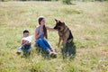 Woman plays with the dog German Shepherd when training Royalty Free Stock Photo