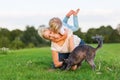 Woman plays with her son and two small dogs Royalty Free Stock Photo