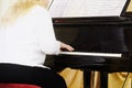 Woman plays the piano