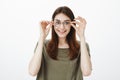 Woman pleased buy new glasses, finally see clearly. Good-looking cheerful girlfriend with beautiful emotive smile