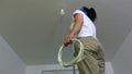 Woman with pliers and electrically conductive wires on a metal stairs