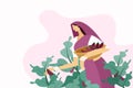 Woman plucking brinjal fruits from the vegetable farm