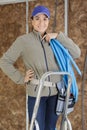 woman plumber standing on ladder Royalty Free Stock Photo