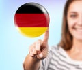 Woman point on the bubble with german flag Royalty Free Stock Photo