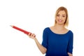 Woman pointing aside with pencil. Royalty Free Stock Photo