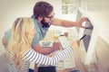 Woman pointing at computer with stylus Royalty Free Stock Photo