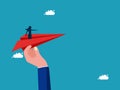 woman pointing a direction to a paper airplane. Help support the achievement of goals. business concept