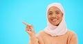 Woman, pointing finger and space for happy muslim announcement with hand for mockup. Islamic female with hijab and face Royalty Free Stock Photo