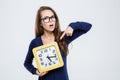 Woman pointing finger on wall clock Royalty Free Stock Photo