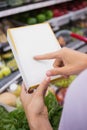 Woman pointing her shopping list Royalty Free Stock Photo