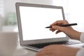 Woman pointing at modern laptop with blank screen Royalty Free Stock Photo