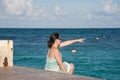 Woman pointing by the ocean Royalty Free Stock Photo