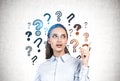 Woman pointing at question marks, good idea Royalty Free Stock Photo