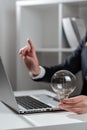 Businesswoman Pointing Recent Updates With One Finger On Desk Holding Lightbulb. Woman In Office Showing Important