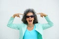 Woman open mouth pointing to Grey Hair Royalty Free Stock Photo