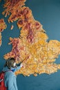 Woman pointing to the map of United Kingdom city of Bristol