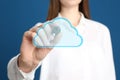 Woman pointing at virtual cloud icon on background, closeup of hand. Data storage concept Royalty Free Stock Photo