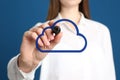 Woman pointing at virtual cloud icon on background, closeup of hand. Data storage concept Royalty Free Stock Photo