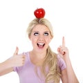 Woman poised with an apple Royalty Free Stock Photo