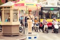 A woman police officer controls traffic on a busy street in Hanoi city