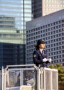 Woman police officer standing on the tower and keeping an order