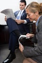 Woman polishing businessmans shoe