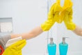 A woman polishing glass using a cleaning sponge and rubber glove Royalty Free Stock Photo