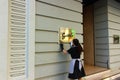 Woman polishing a restaurant sign