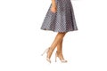 Woman in polka-dot dress standing in shoes