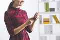 Woman with ponytail in red dress holding smartphone Royalty Free Stock Photo