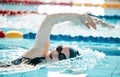 Woman, pool and swimming in water for sports fitness, exercise or training in olympic or athletics. Female person Royalty Free Stock Photo