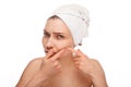 Woman popping zit Royalty Free Stock Photo