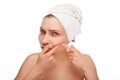 Woman popping zit