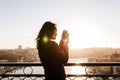 Woman in Porto bridge taking pictures with camera at sunset. Tourism in city Europe. travel Royalty Free Stock Photo