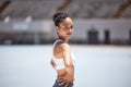 Woman portrait, athlete and fitness in an outdoor stadium happy about exercise, training and run. Black woman sports