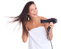 Woman, portrait and blow dryer and hair treatment in studio with salon tool with towel for morning routine, white Royalty Free Stock Photo