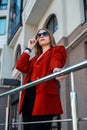 woman portrait of businesswoman in a suit standing near an office building with her Royalty Free Stock Photo