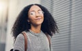 Woman, portrait and city travel of student with glasses on a street with freedom. Urban, university holiday and happy Royalty Free Stock Photo