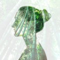 Woman portrait with double exposure and with green bamboo trees close up Royalty Free Stock Photo