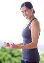 Woman, portrait and dumbbell with lifting weights for fitness in nature with smile, wellness or healthy body. Athlete Royalty Free Stock Photo