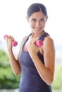 Woman, portrait and dumbbell with lifting weights for fitness outdoor with smile, wellness or healthy body. Athlete Royalty Free Stock Photo